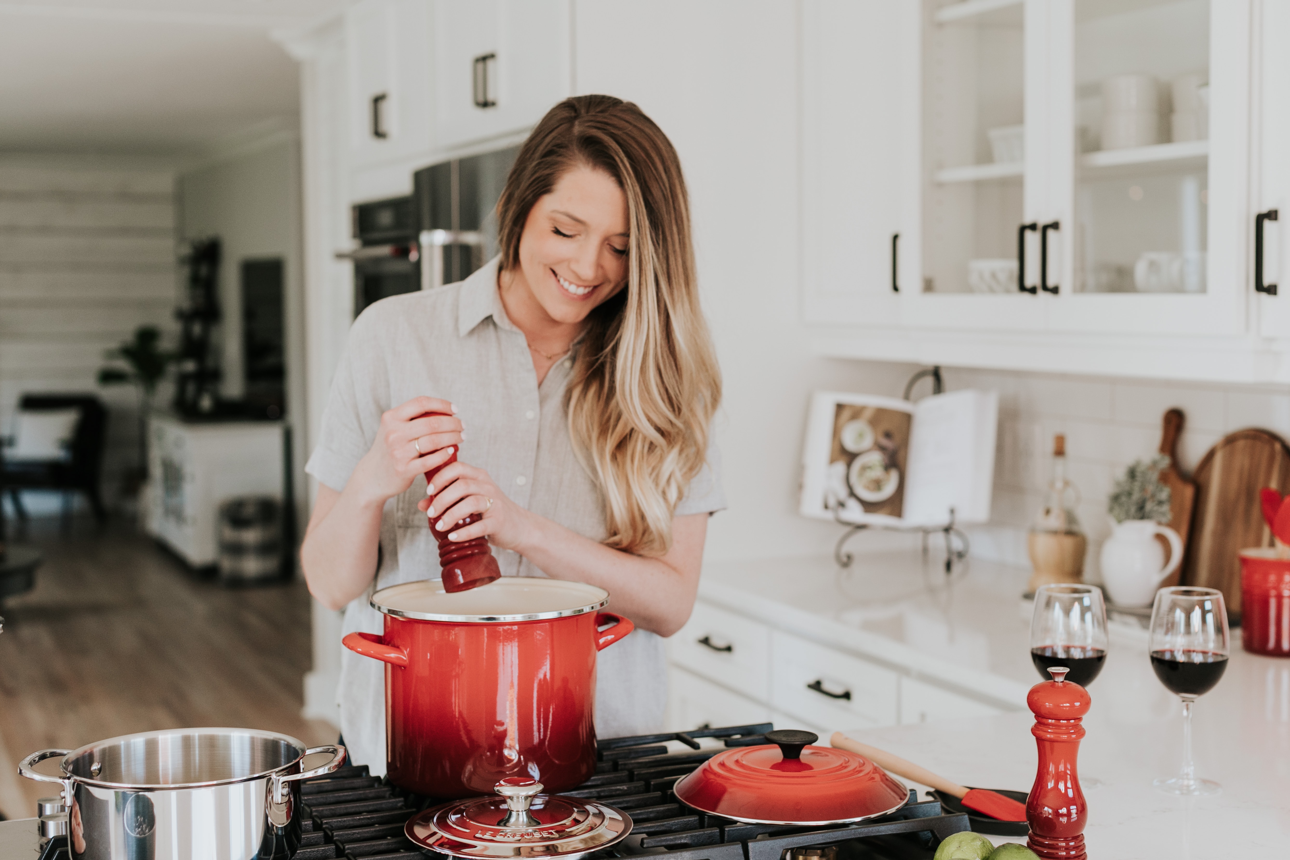 Girl stirring a deep soup pot on a stove